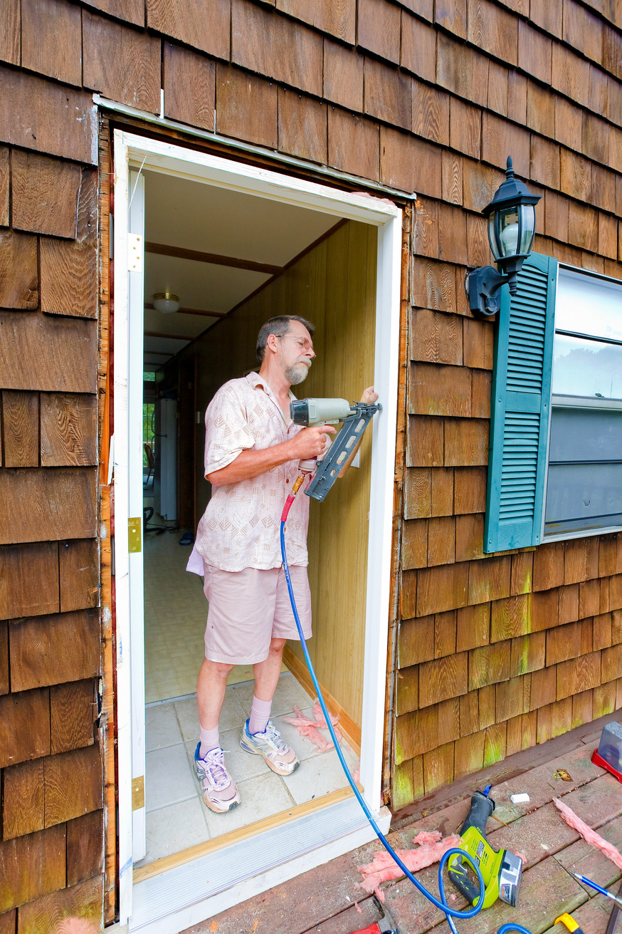 Carpenter Replacing Door Frame